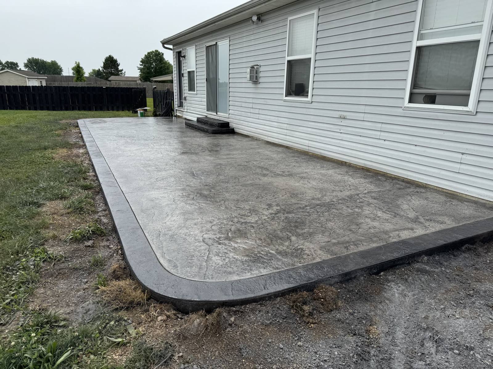 Broom-finish concrete driveway installed for a home in Dayton, Ohio