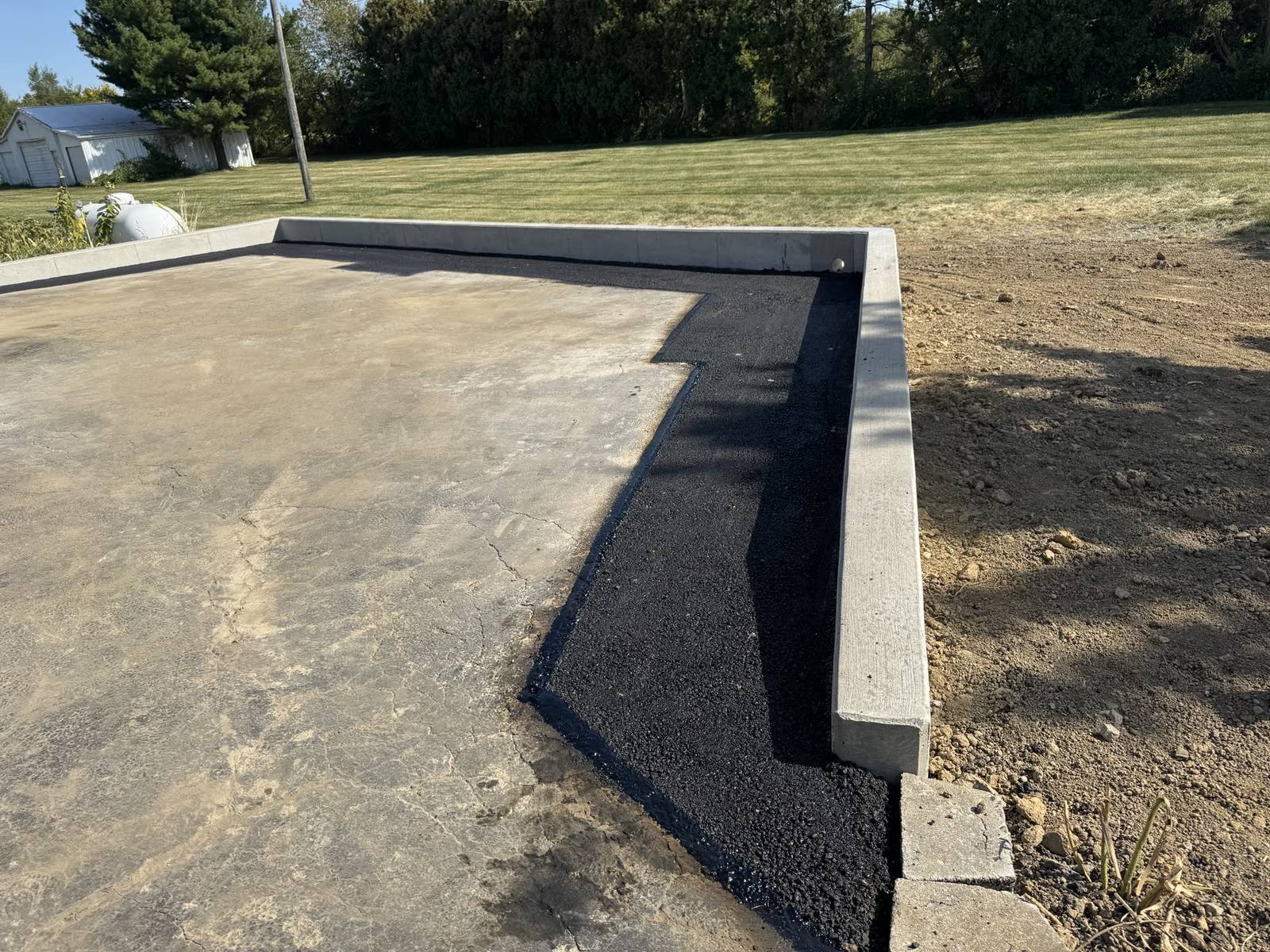 Polished curved concrete patio with a premium rounded layout in Southwest Ohio